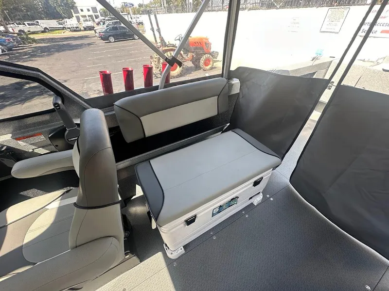Slide: The Image of Interior of 2024 KingFisher 2025 Escape boat with seating and storage. - 30