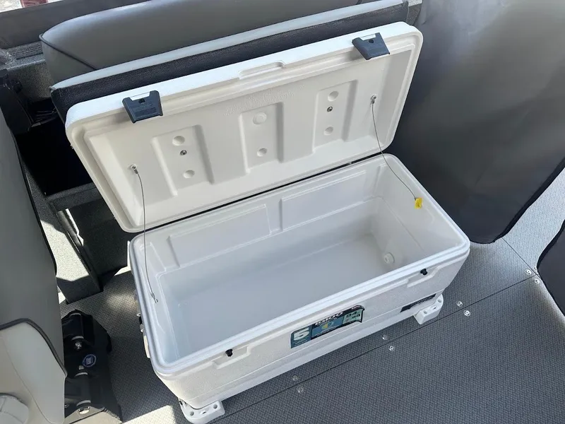 Slide: The Image of Open white cooler inside 2024 KingFisher 2025 Escape boat, on gray carpeted floor. - 31