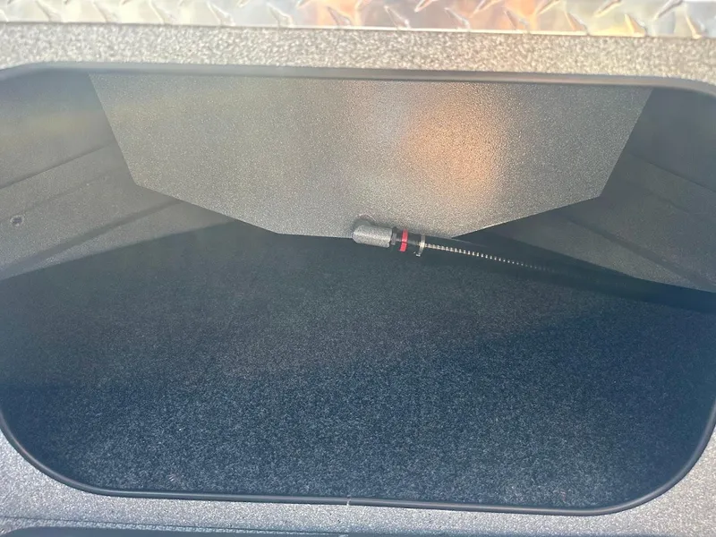 Slide: The Image of Storage compartment of 2024 KingFisher 2025 Escape boat, featuring durable interior design. - 41