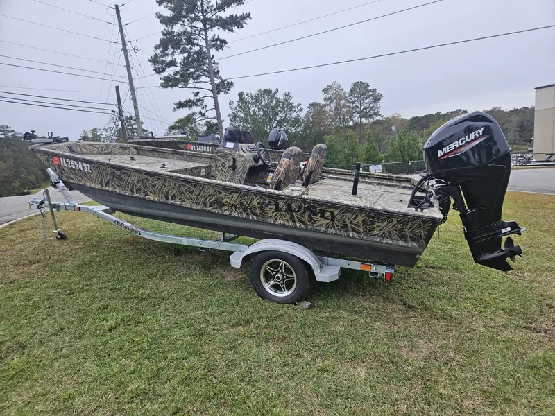 Slide: The Image of 2021 Lund 1760 Predator SC boat with Mercury outboard motor on trailer. - 4