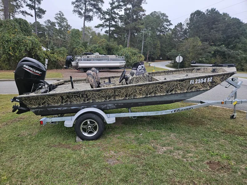 Slide: The Image of 2021 Lund 1760 Predator SC boat on EZ Loader trailer with Mercury outboard motor. - 6