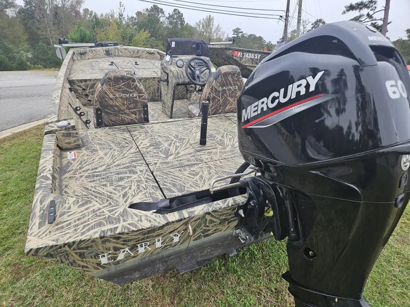 Slide: The Image of 2021 Lund 1760 Predator SC boat with Mercury 60 outboard motor, camo design. - 8