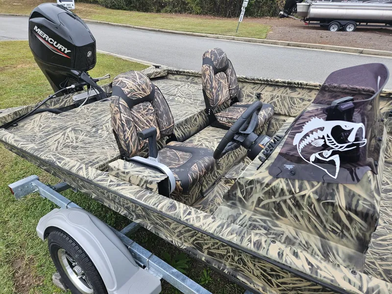 Slide: The Image of 2021 Lund 1760 Predator SC boat with camo seats and Mercury outboard motor. - 9