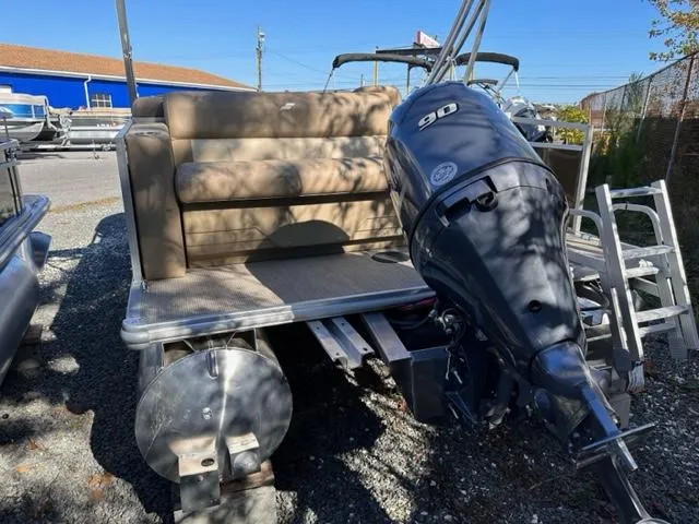 Slide: The Image of 2024 Starcraft LX 20 CB pontoon boat with 90 HP outboard motor. - 8