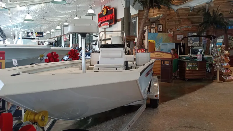 Slide: The Image of 2024 Ranger RB200 boat displayed in a showroom with nautical decor. - 1