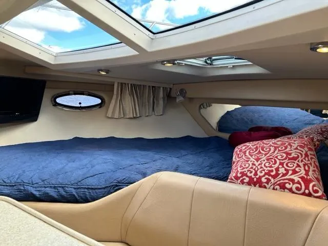 Slide: The Image of Interior cabin of 2010 Regal 3060 Window Express with skylight and cozy bedding. - 32