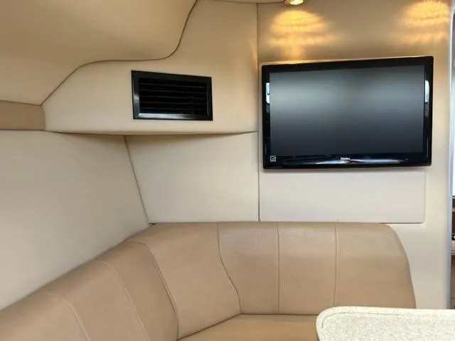 Slide: The Image of Interior of 2010 Regal 3060 Window Express with TV and beige seating. - 33