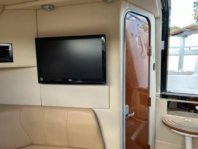 Slide: The Image of Interior of 2010 Regal 3060 Window Express with TV and seating area. - 47