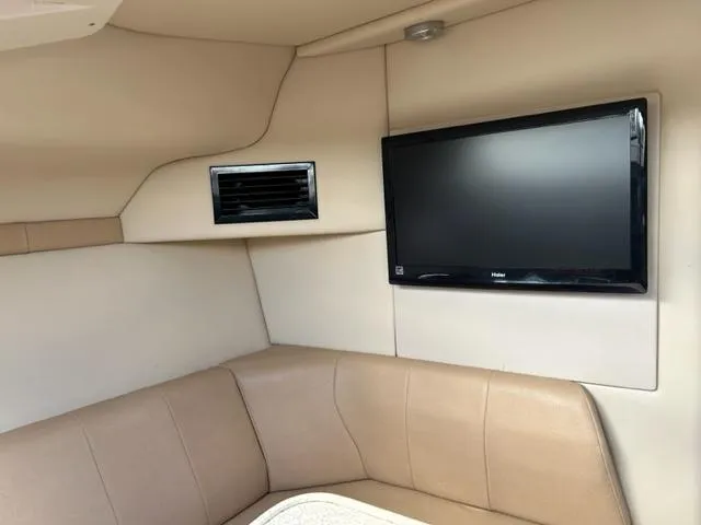 Slide: The Image of Interior of 2010 Regal 3060 Window Express with TV and seating area. - 48