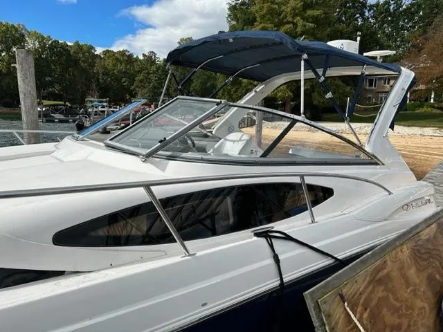 Slide: The Image of 2010 Regal 3060 Window Express boat docked at a marina. - 5