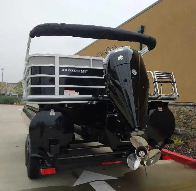 Slide: The Image of 2024 Ranger Reata 223C pontoon boat with outboard motor, rear view. - 2