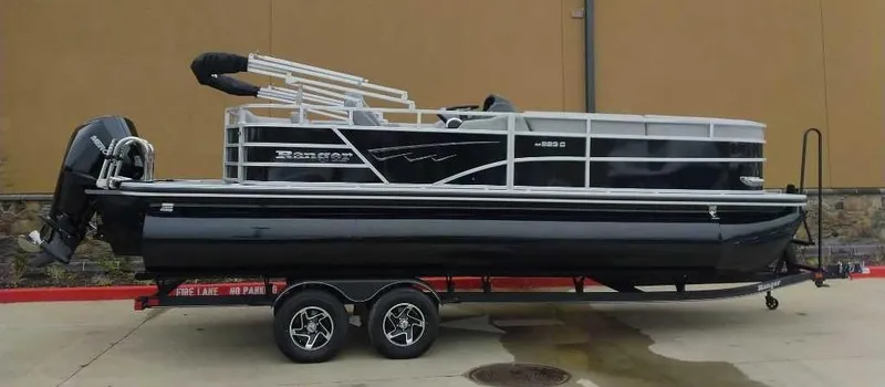 Slide: The Image of 2024 Ranger Reata 223C pontoon boat on a trailer. - 4