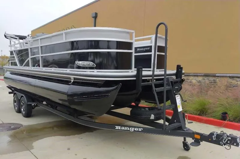 Slide: The Image of 2024 Ranger Reata 223C pontoon boat on a trailer. - 5