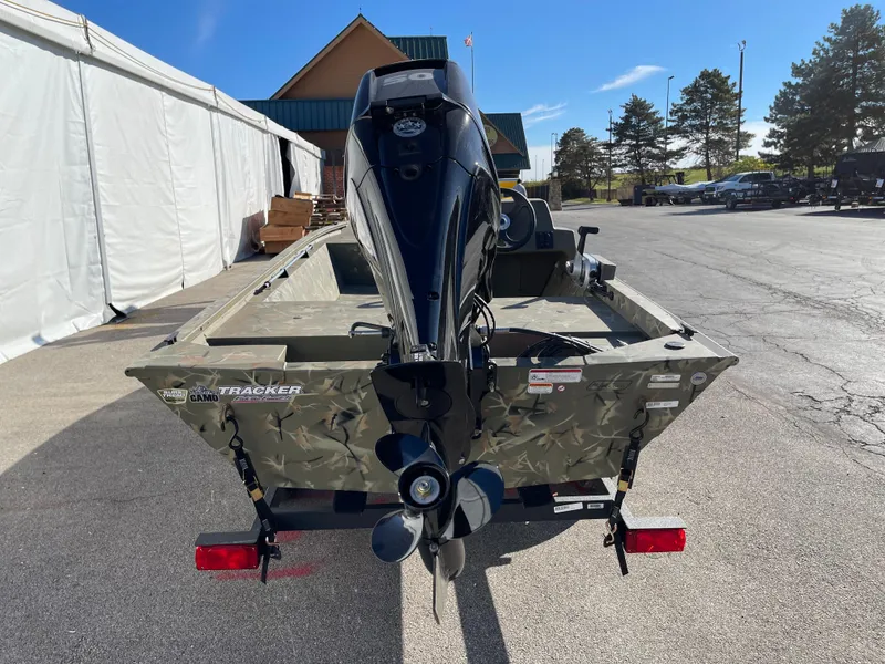 Slide: The Image of 2024 Tracker Grizzly 1648 SC boat rear view with outboard motor. - 3