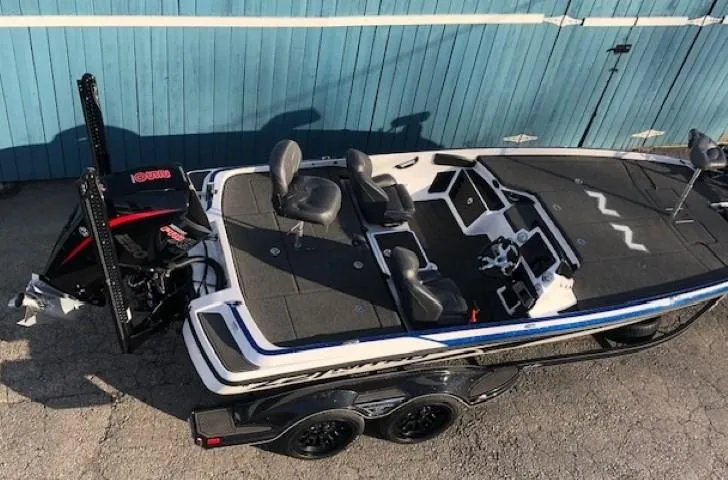 Slide: The Image of 2022 Nitro Z21 XL bass boat with dual console and outboard motor. - 11