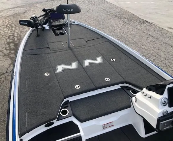 Slide: The Image of 2022 Nitro Z21 XL boat deck with storage compartments and fishing seat. - 14