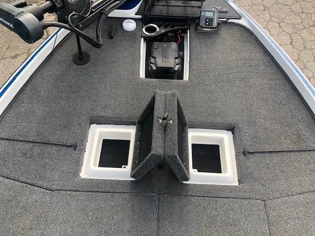 Slide: The Image of 2022 Nitro Z21 XL boat deck with storage compartments and fishing equipment. - 15