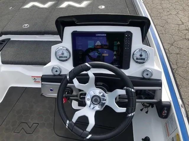 Slide: The Image of 2022 Nitro Z21 XL boat dashboard with Lowrance display and steering wheel. - 27
