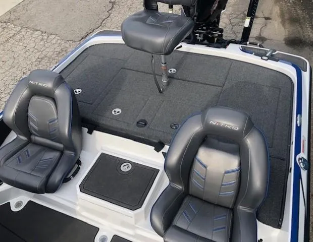 Slide: The Image of 2022 Nitro Z21 XL boat interior with three seats and storage compartments. - 36