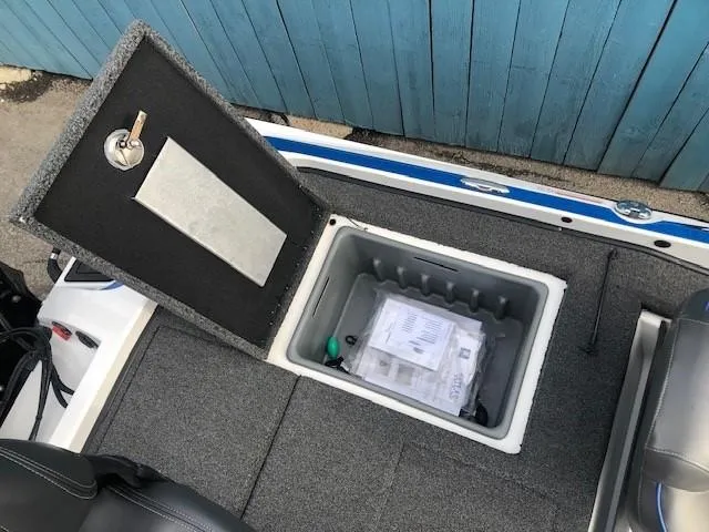 Slide: The Image of 2022 Nitro Z21 XL boat storage compartment with documents and accessories. - 37