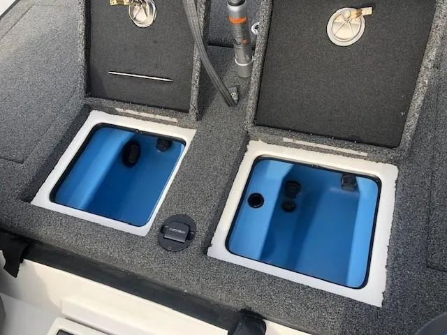 Slide: The Image of 2022 Nitro Z21 XL livewell compartments with blue interior. - 39