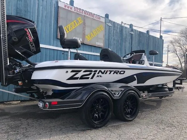 Slide: The Image of 2022 Nitro Z21 XL boat parked on a trailer at a marina. - 4