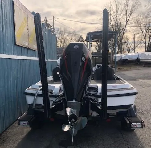 Slide: The Image of 2022 Nitro Z21 XL boat rear view with outboard motor and power poles. - 7