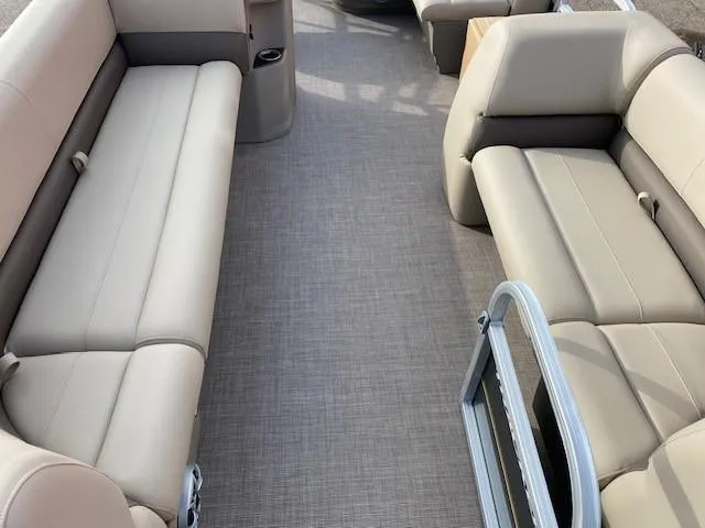 Slide: The Image of Interior of 2024 Sun Tracker Party Barge 18 DLX pontoon boat with beige seating. - 8
