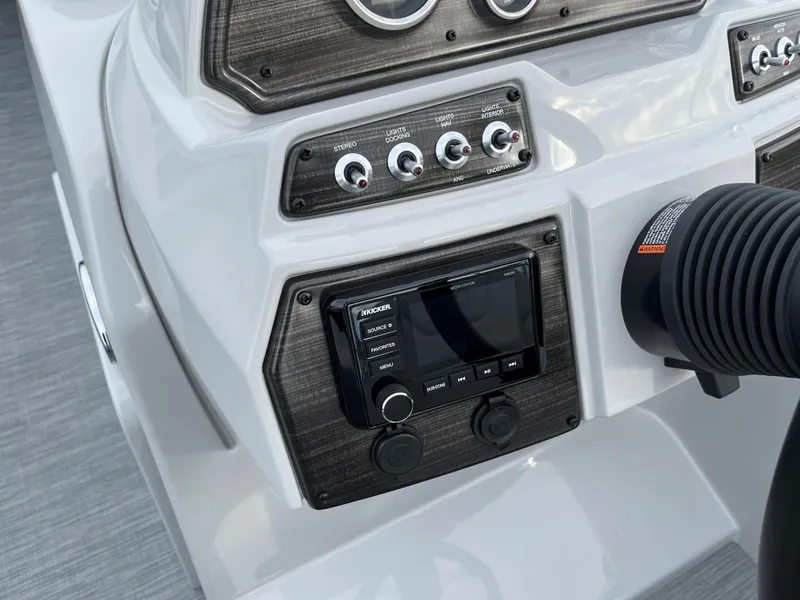 Slide: The Image of Control panel of 2024 Lowe SS 210 WT boat with modern dashboard and switches. - 18