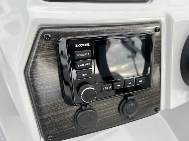 Slide: The Image of 2024 Lowe SS 210 WT boat dashboard with Kicker audio system. - 21
