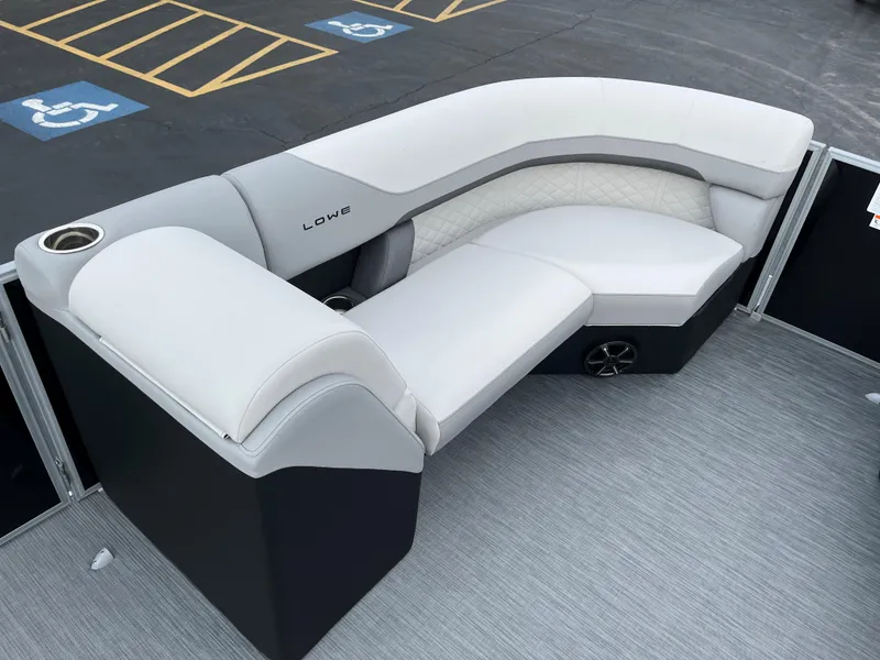 Slide: The Image of 2024 Lowe SS 210 WT pontoon boat with luxurious seating and cup holders. - 23