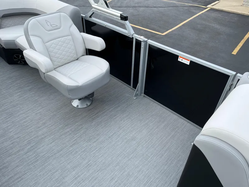 Slide: The Image of 2024 Lowe SS 210 WT boat interior with gray captain's chair and flooring. - 25