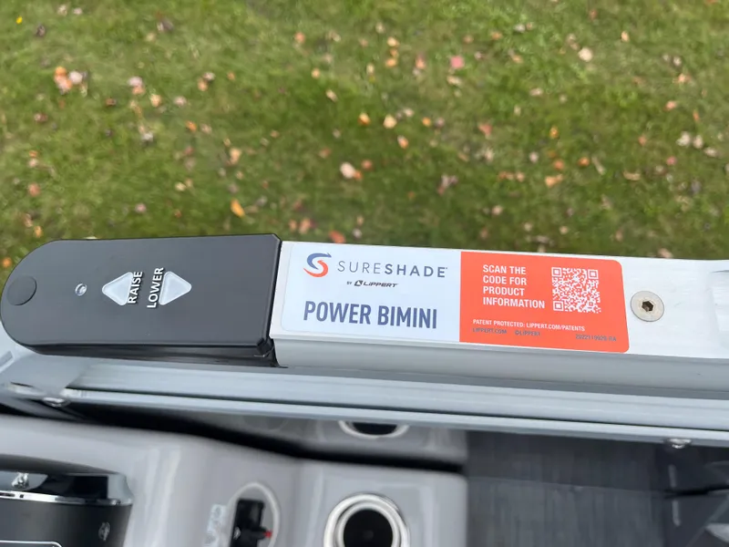 Slide: The Image of Lowe SS 210 WT 2024 SureShade Power Bimini control panel with QR code. - 26