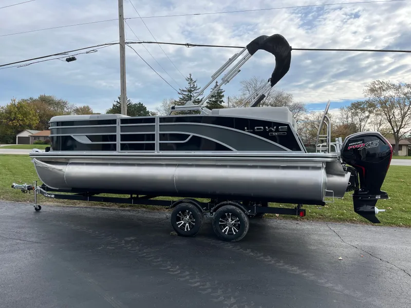 Slide: The Image of 2024 Lowe SS 210 WT pontoon boat on a trailer. - 28