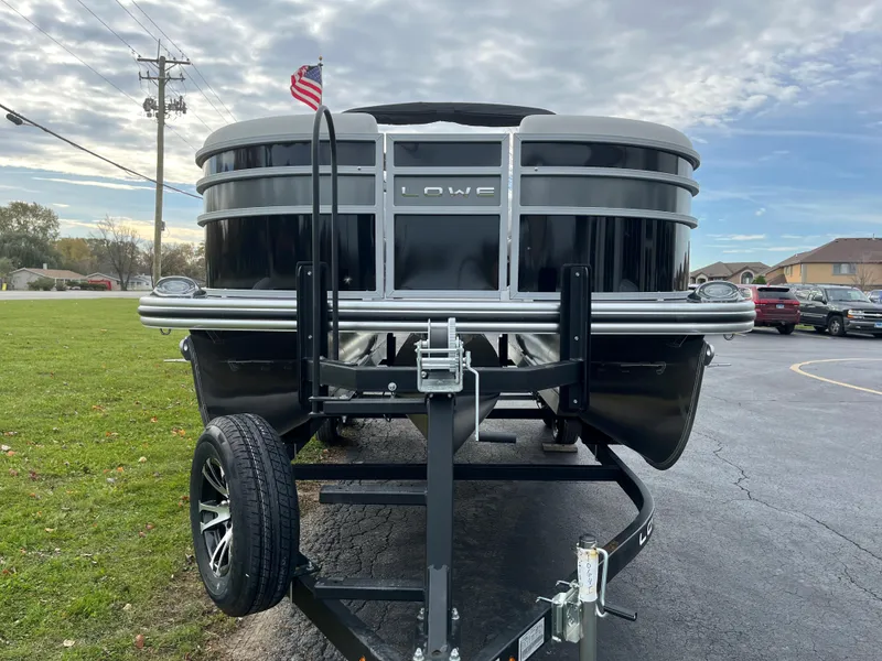 Slide: The Image of 2024 Lowe SS 210 WT pontoon boat on a trailer, front view. - 5