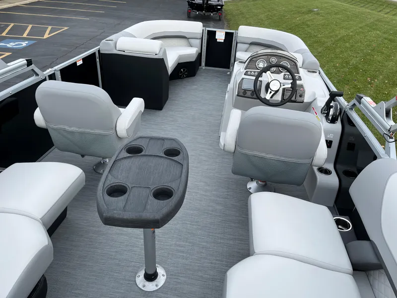 Slide: The Image of 2024 Lowe SS 210 WT pontoon boat interior with seating and helm. - 6