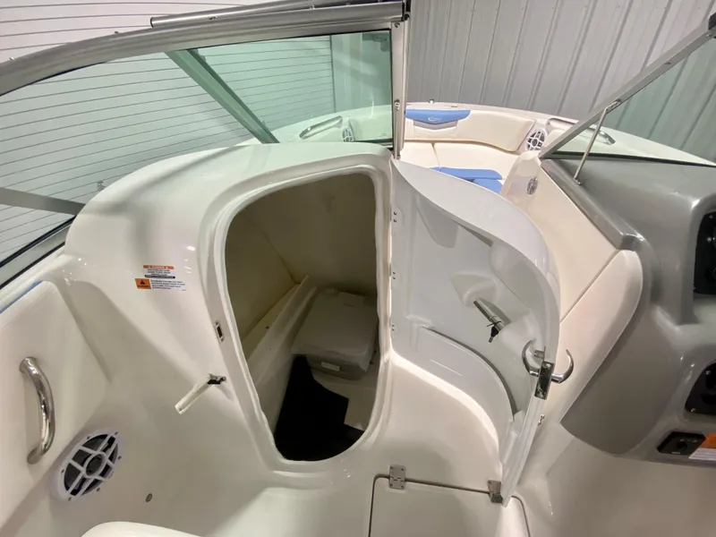 Slide: The Image of 2024 Robalo R207 Dual Console boat interior with storage compartment. - 16