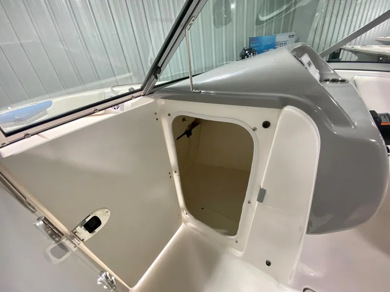 Slide: The Image of 2024 Robalo R207 Dual Console storage compartment. - 18