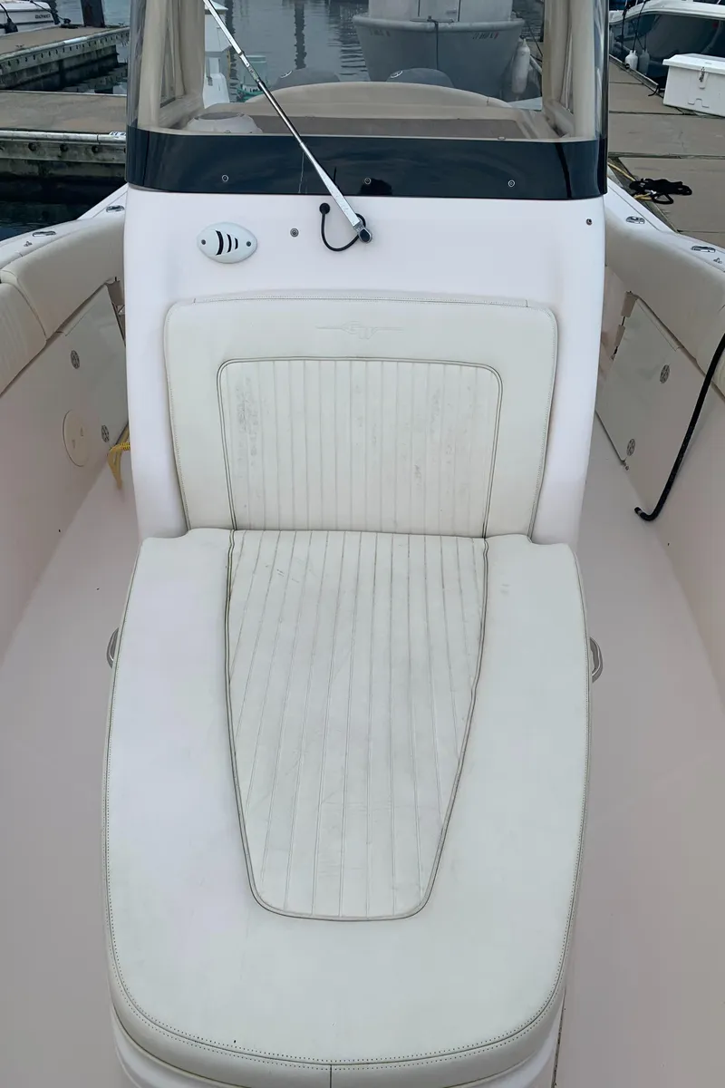 Slide: The Image of 2013 Grady-White Canyon 271 boat seating area at the dock. - 19