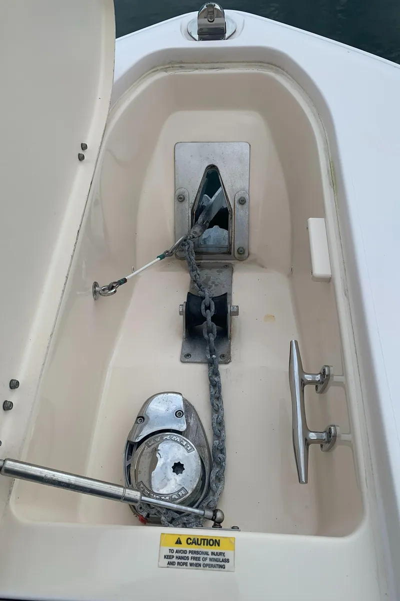 Slide: The Image of 2013 Grady-White Canyon 271 anchor locker with windlass and chain. - 21