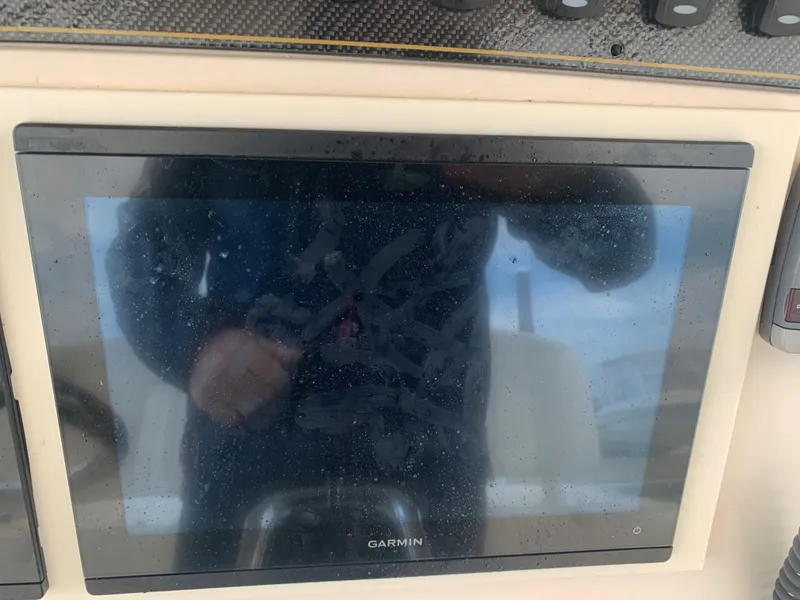 Slide: The Image of Garmin display on 2013 Grady-White Canyon 271 boat dashboard. - 25