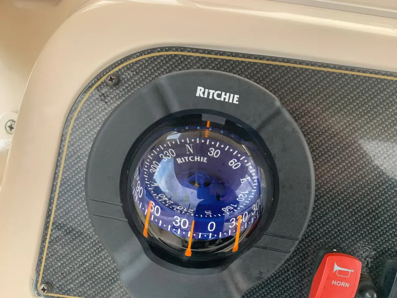 Slide: The Image of Ritchie compass on 2013 Grady-White Canyon 271 boat dashboard. - 28