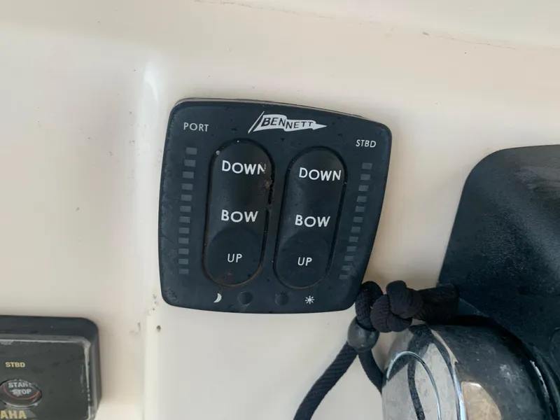 Slide: The Image of Bennett trim tab control panel on 2013 Grady-White Canyon 271 boat. - 30