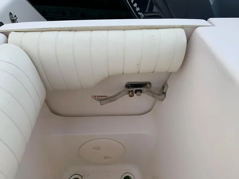 Slide: The Image of 2013 Grady-White Canyon 271 boat interior with white cushioned seating. - 32