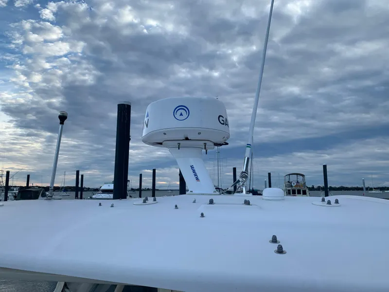 Slide: The Image of 2013 Grady-White Canyon 271 boat radar and antenna against cloudy sky. - 36