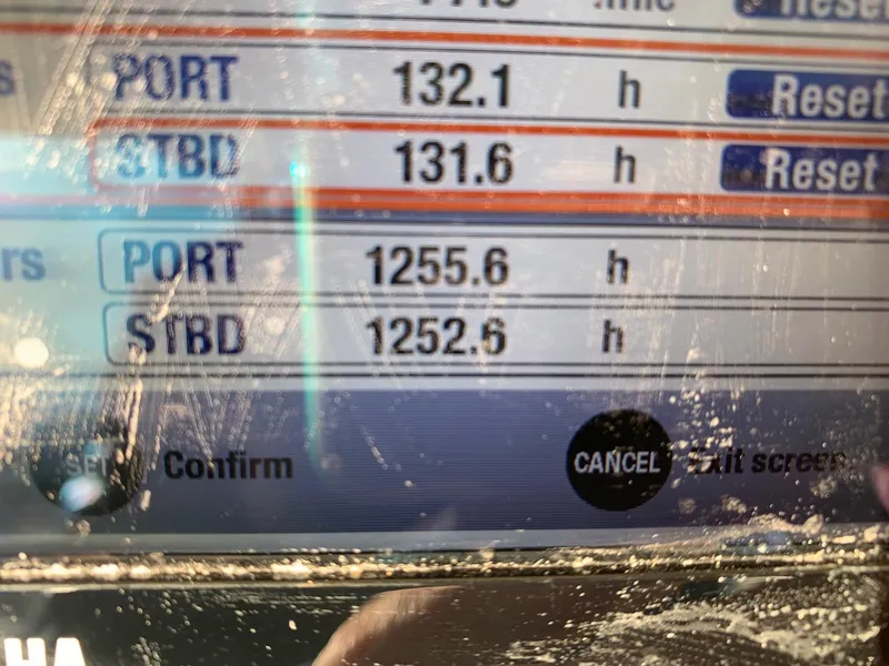 Slide: The Image of Grady-White Canyon 271 2013 engine hours display showing port and starboard hours. - 39