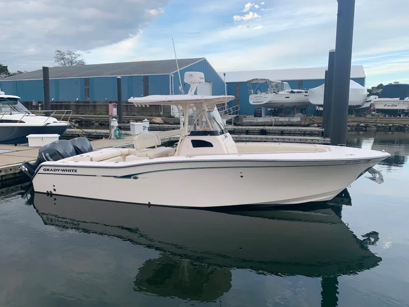 Slide: The Image of 2013 Grady-White Canyon 271 boat docked at marina. - 5