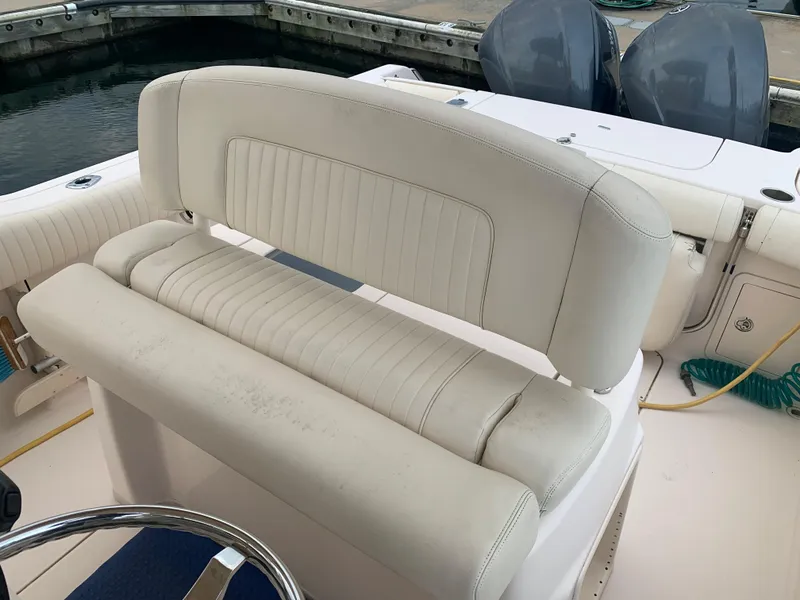 Slide: The Image of 2013 Grady-White Canyon 271 boat seating and helm area. - 6