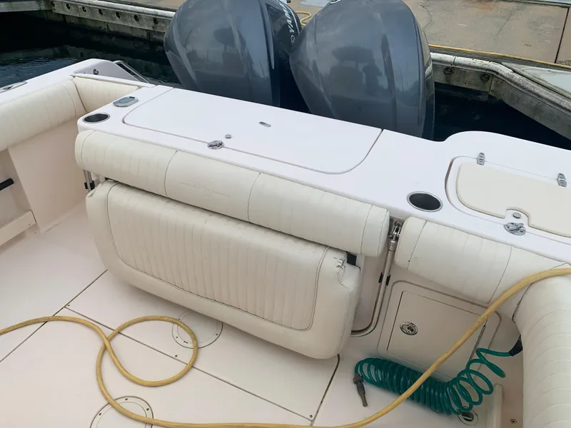 Slide: The Image of 2013 Grady-White Canyon 271 boat interior with dual outboard motors. - 7