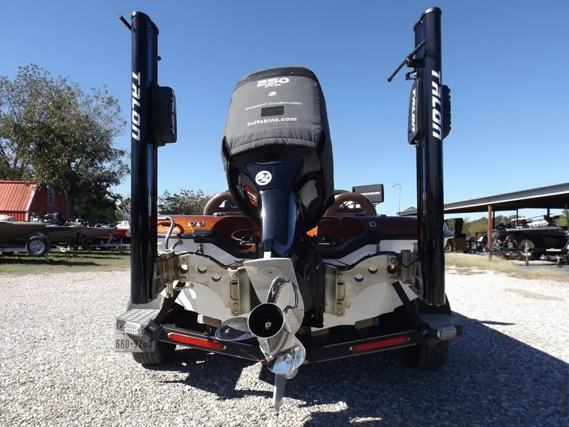 Slide: The Image of 2017 Legend V21 boat rear view with Talon anchors and powerful outboard motor. - 12